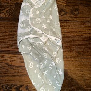 Whimsical Green Swaddle with Stars and Swirls